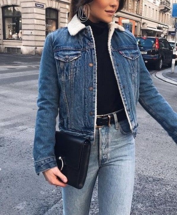 woman wearing blue denim jacket with blue jeans and black turtle neck